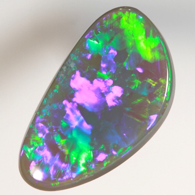 SOLID BLACK OPAL Neon turquoise and green in large rolling flashes. SEE VIDEO